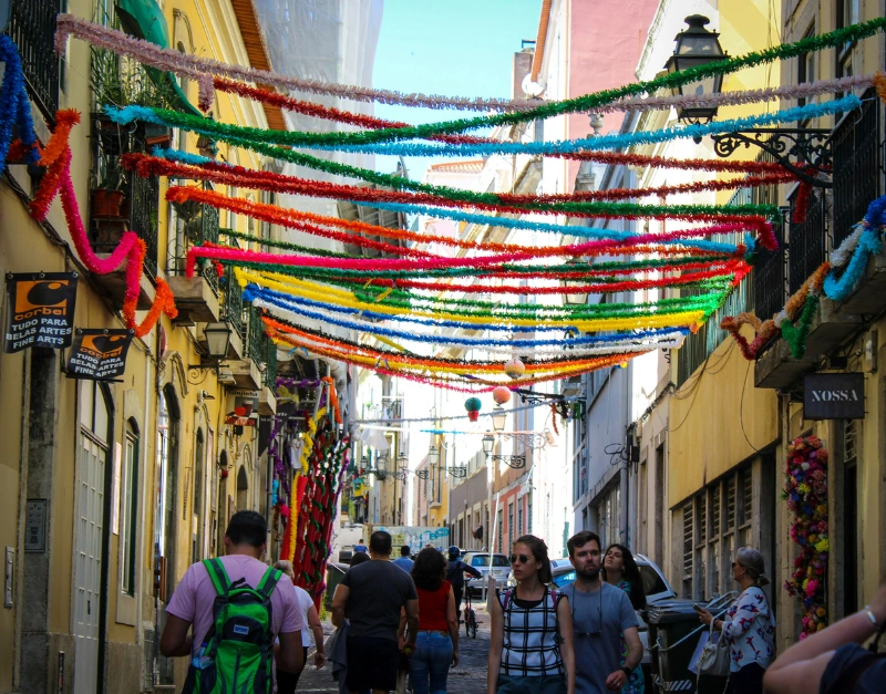 Narrow cobblestone street in Bairro Alto Lisbon during the day, with colourful facades and a quiet atmosphere